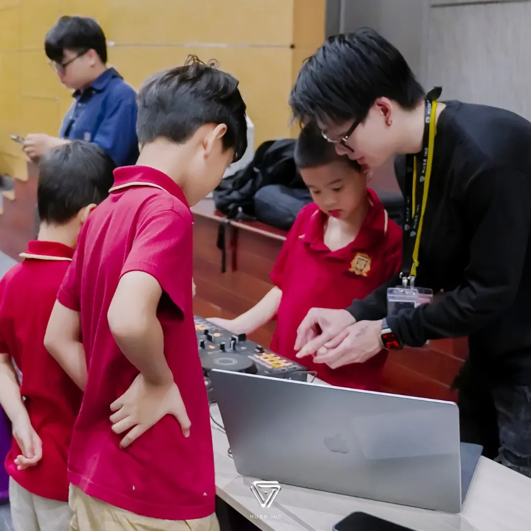 A Muse Inc instructor showing VAS students how DJ equipment works