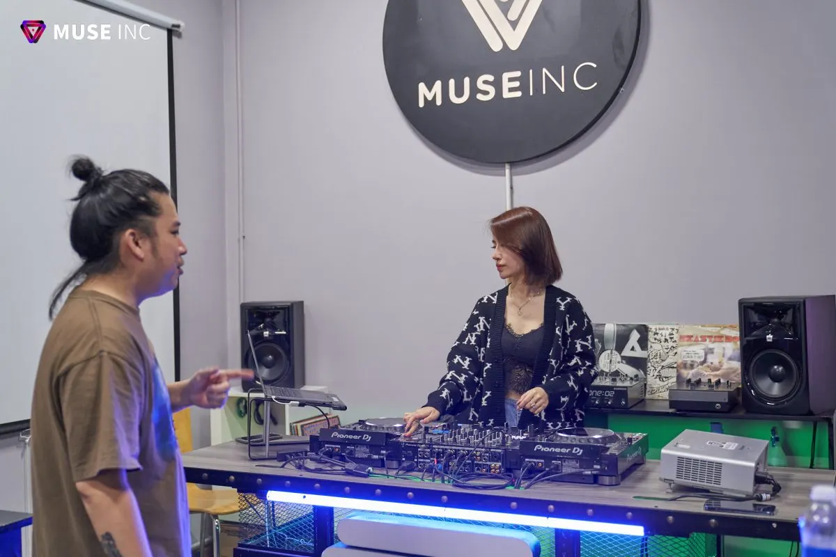 A DJ checking equipment before a gig